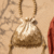 pomelli_photoshoot_image_9_16_0422 (4) - Copy - Copy Golden Pearl Handle Potli Bag