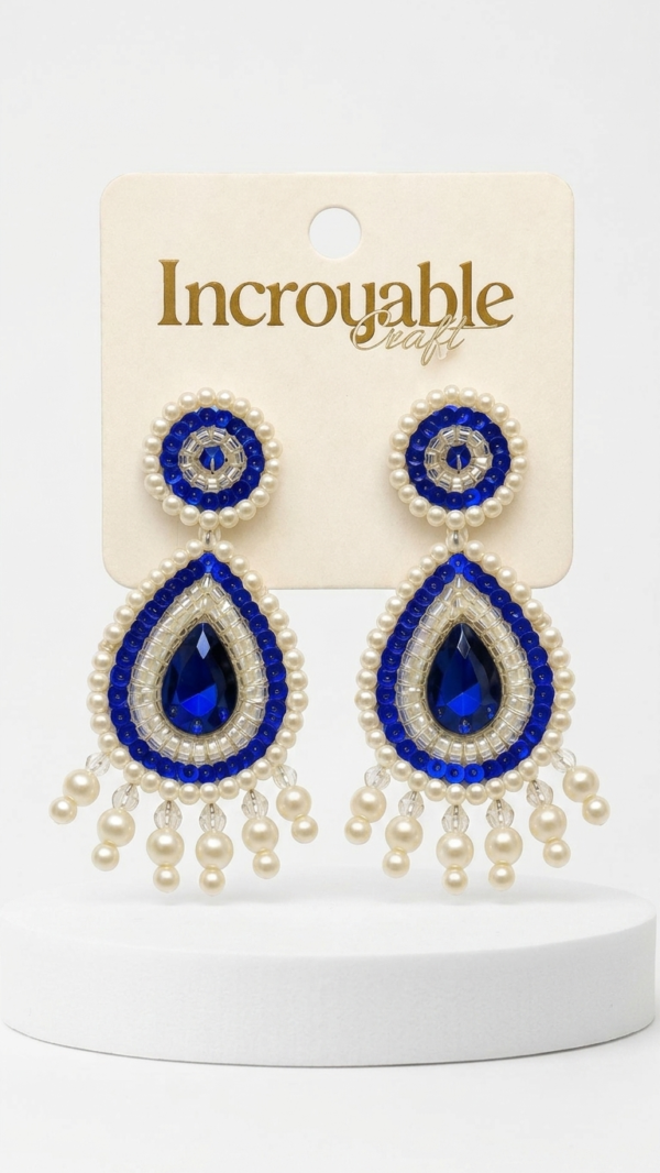 pomelli_photoshoot_image_9_16_0703 (1) Royal Sapphire Pearl Drop Earrings
